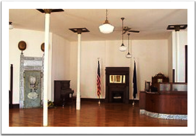 Photo of interior view of old bank building.